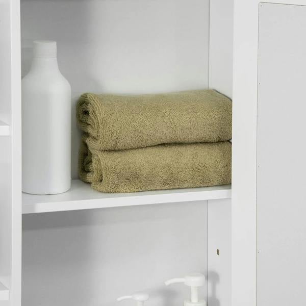 White wall-mounted bathroom cabinet interior shelf with neatly folded green towel