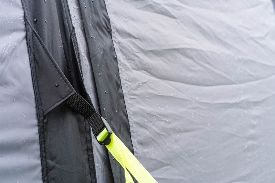 A closeup of the OLPRO Blakedown Breeze 4 Berth Inflatable Tent storm strap that has been tightened.