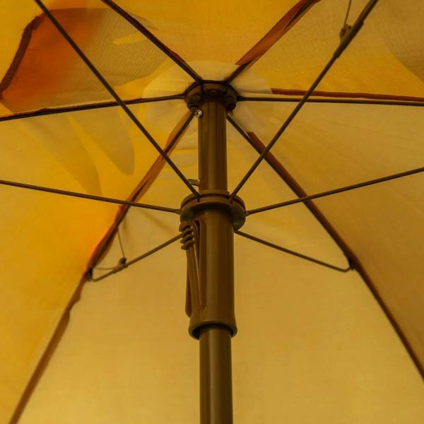 Brown sun umbrella canopy with monkey center panel and umbrella support pole
