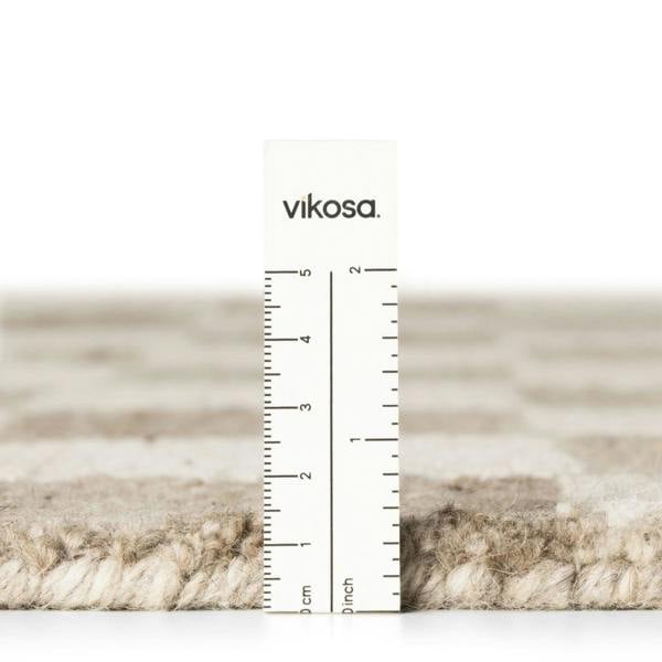 Textured material swatch with a ruler and 'vikosa' branding on a white background