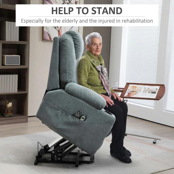 Charcoal grey lift-and-recline massage armchair supporting a seated person with footrest lowered.