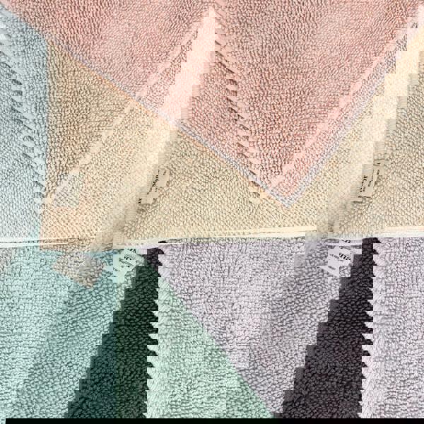 Collection of textured organic cotton loop bath mats in various colours by misona.