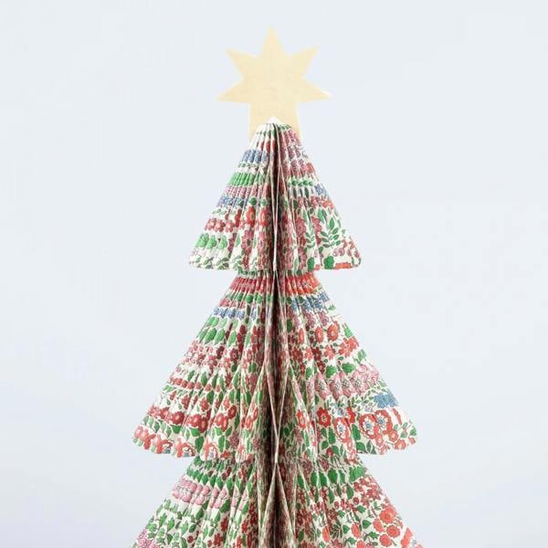 A single 3D paper honeycomb Christmas tree featuring an intricate red, green, and blue Liberty floral print pattern, topped with a metallic gold star.