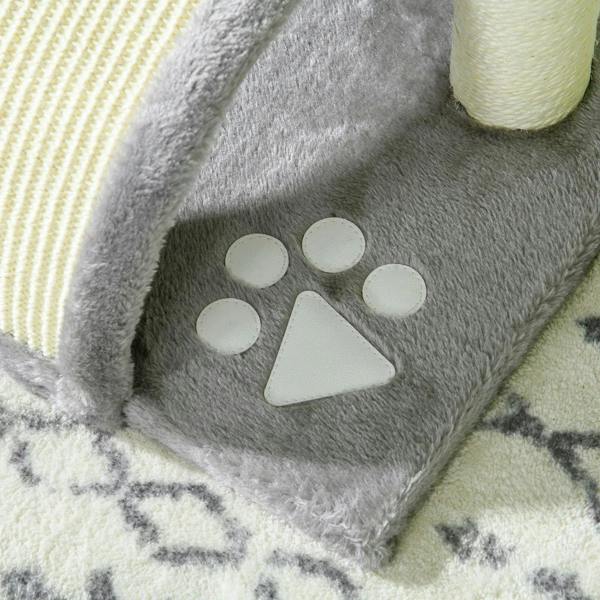 Close-up of grey arched scratch tunnel with paw-print applique