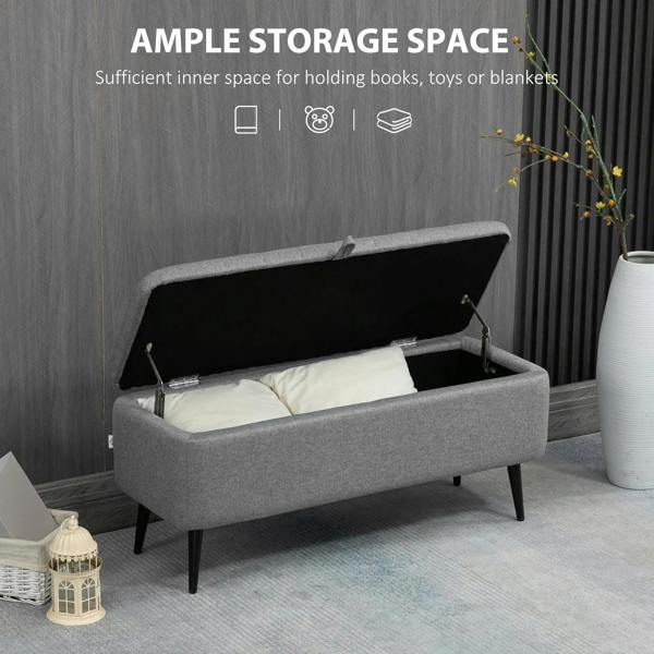 Grey flip-top storage ottoman with open compartment, linen-look fabric and steel legs
