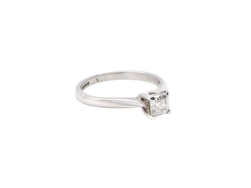 An emerald cut platinum solitaire Diamond Ring