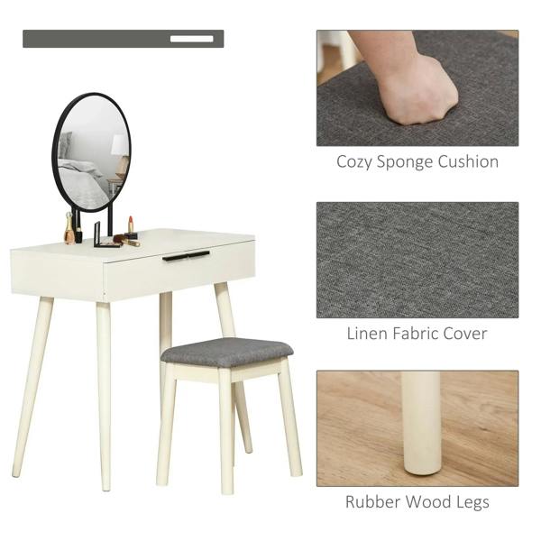 White vanity table with round mirror and gray linen-covered cushioned stool