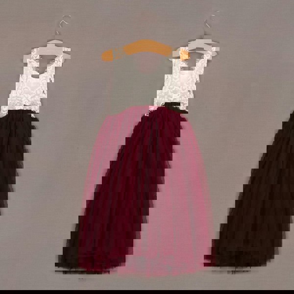 Burgundy dress with lace top on a wooden hanger against a gray background