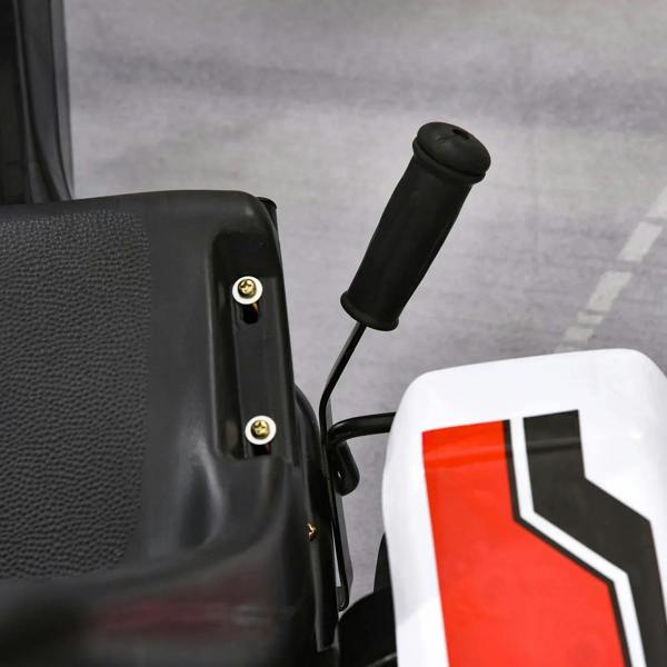 Close-up of black steering grip and seat on a white-and-black kids pedal go-kart