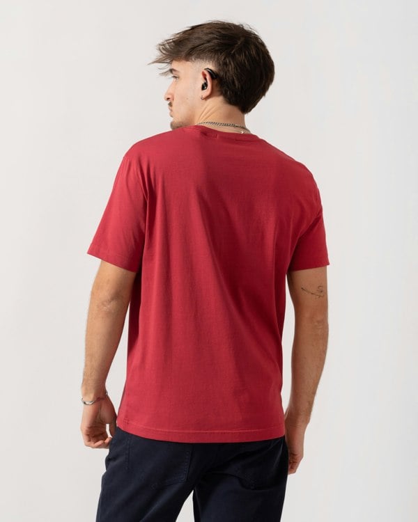 Person wearing a red t-shirt on a white background