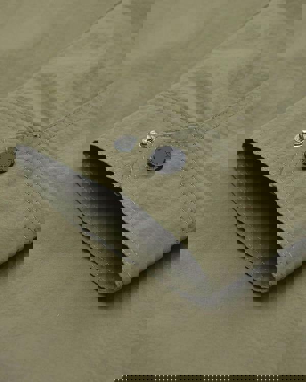 Lambretta Kalmar Mens Military Utility Casual Smart Coat Jacket, close-up of the sleeve cuff with a metal snap button and fabric logo badge.