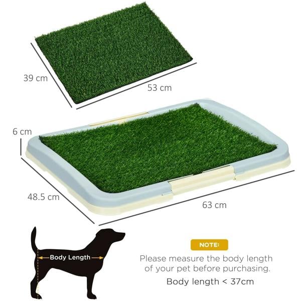 Green artificial grass puppy training pad with white raised tray and grid panel underside