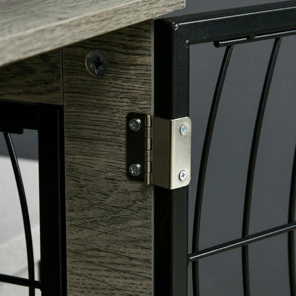 Close-up of black wire door hinge and latch on grey dog crate end table