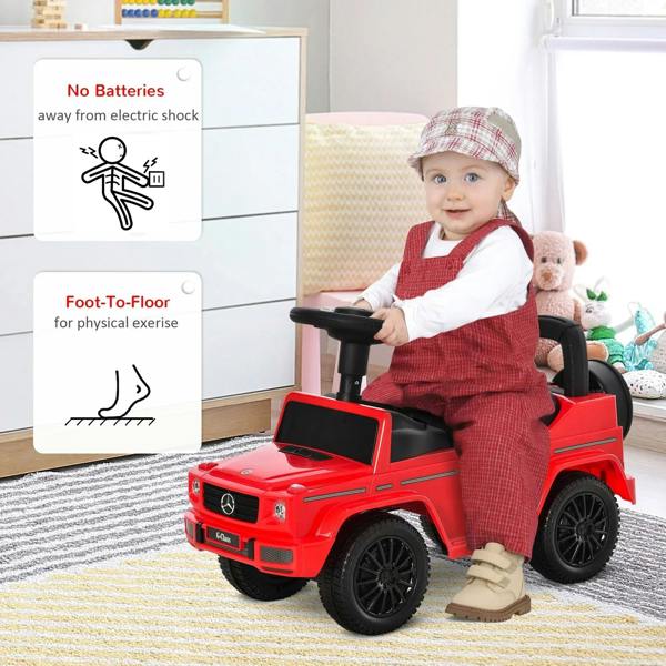Red kids push car with toddler seated, black seat and steering wheel, indoor floor