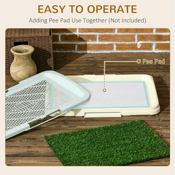 Green artificial grass puppy training pad with open white tray and grid panel