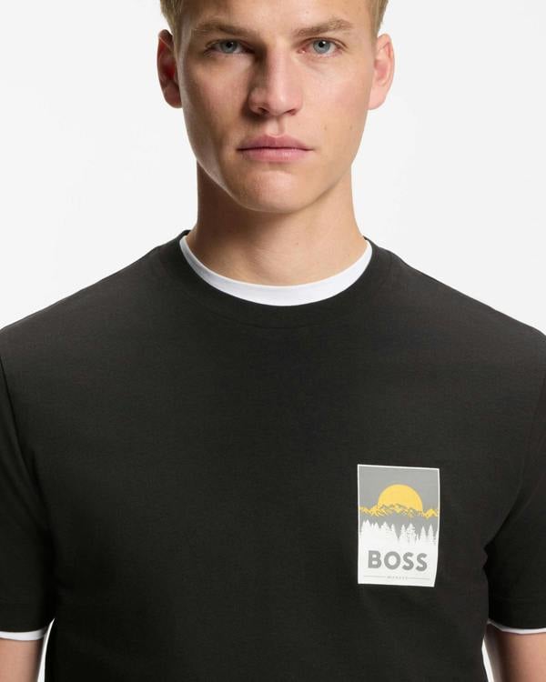 Model wearing BOSS Orange TePlain Mens Cotton-Jersey T-Shirt with Logo Artwork in Black 001 - close up