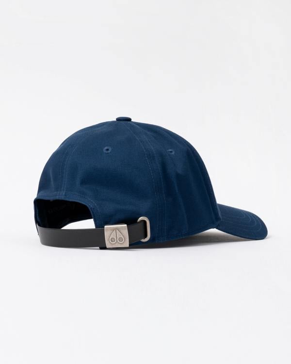 back view of a Moose Knuckles Front Logo Icon Cap in Nightfall 1977
