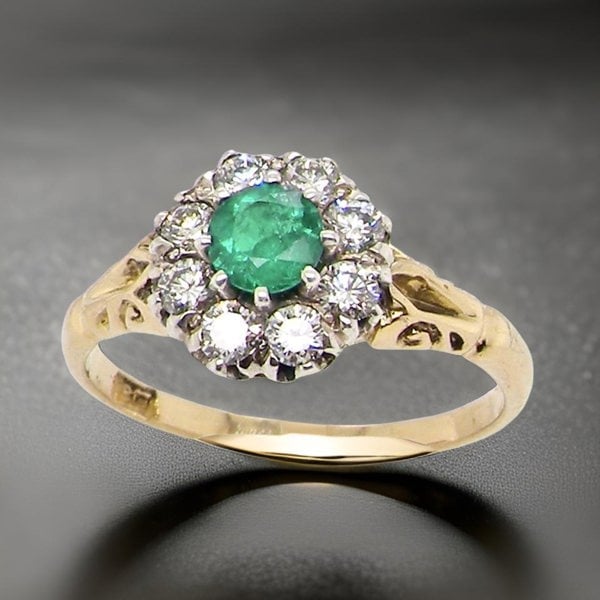 Vintage Tom A vintage Emerald and Diamond cluster ring