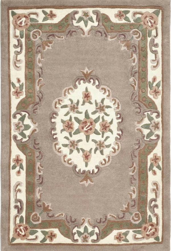 Decorative rug with intricate patterns and floral designs on a beige background