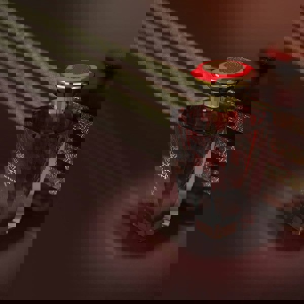 Adyan Muwood Marakaz 100ml EDP Red and gold perfume bottle with a blurred background