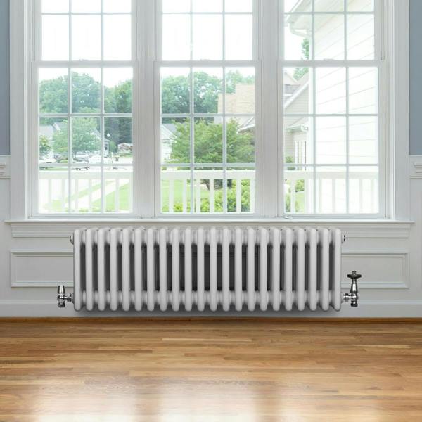 Traditional 4 column radiator in white, 300 x 1010mm, featuring a sleek design and smooth finish, installed beneath a large window
