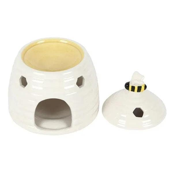 White ceramic beehive oil burner with tealight cup and hex side cutouts