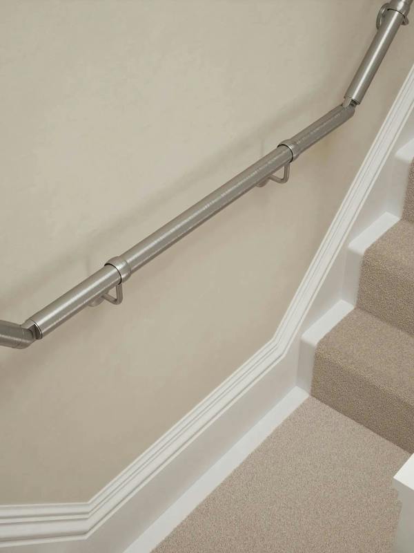Harbury Brushed Silver wall-mounted handrail installed on a T-shape staircase, alternate front view – Handrails Direct UK supplier of modular indoor handrails and fittings