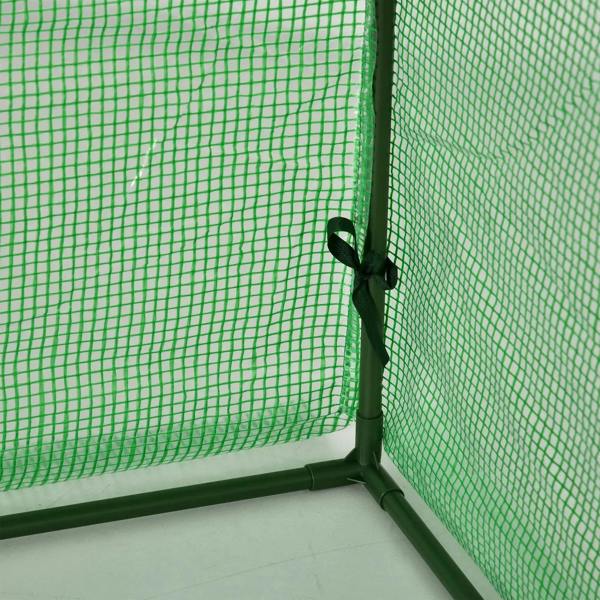 Close-up of green mesh greenhouse cover secured to steel frame with zipper