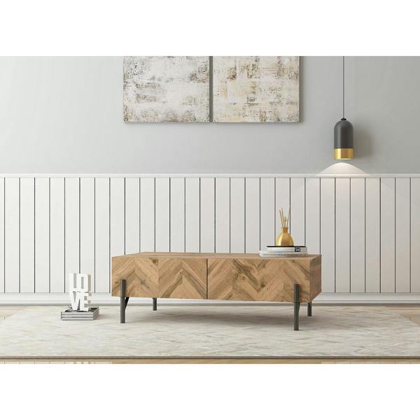 Coffee table in a modernly decorated living room. It shows 2 pull out drawers and the top surface area in use.
