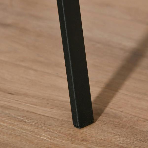 Black metal coat rack leg with flat protective base on a wooden floor