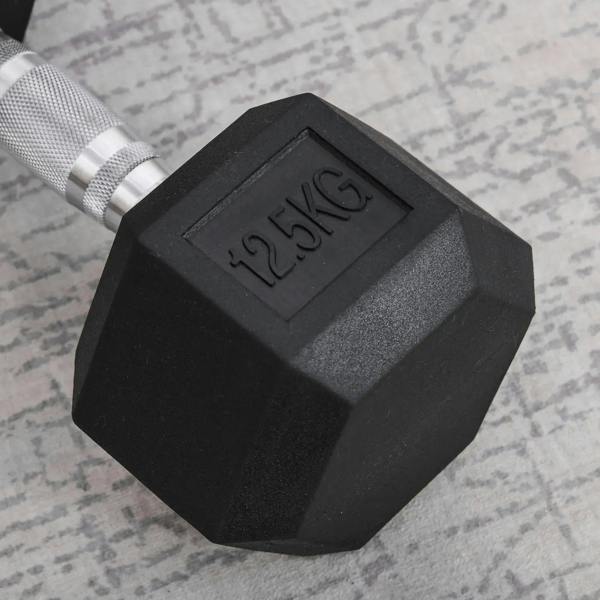 Black 12.5 kg rubber hex dumbbell head close-up with embossed weight