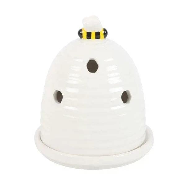 White bee-hive incense cone holder with black and yellow striped top, side holes