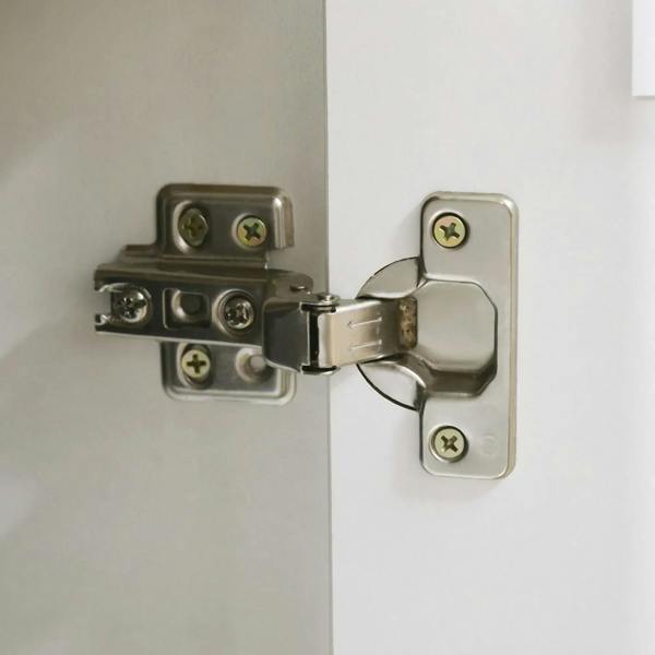 White desk cabinet door hinge and latch hardware with metal screws