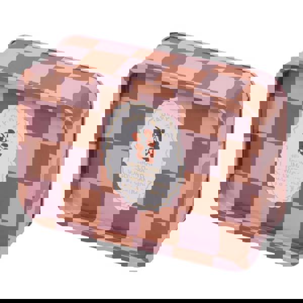 The stunning candle features a blend of lemon, tomato, and basil