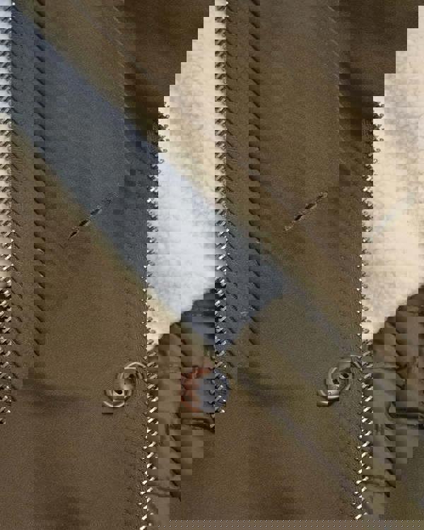 Lambretta Mens/Womens Carnaby Scooter Hooded Classic Mod Ska Badge Parka, close-up of the brown parka featuring a zippered front, decorative button, quilted lining, and soft fleece interior.