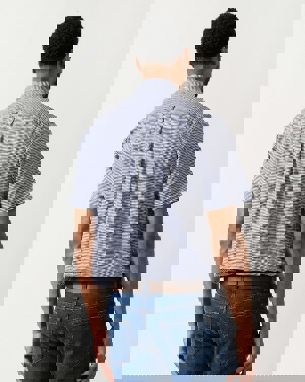 back shot of a Model wearing a GANT Mens Regular Fit Classic Poplin Gingham Short Sleeve Shirt in Persian Blue