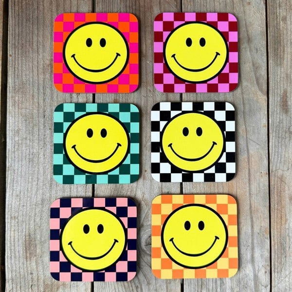 Smiley Coasters on a Checkerboard background. Designed by Love Frankie