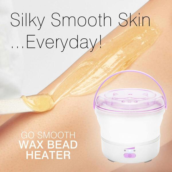 A person uses a spatula to apply wax to their leg for full-body hair removal. Text reads: Silky Smooth Skin...Everyday! GO SMOOTH HARD WAX HEATER by Rio. A white and purple wax heater appears in the foreground.