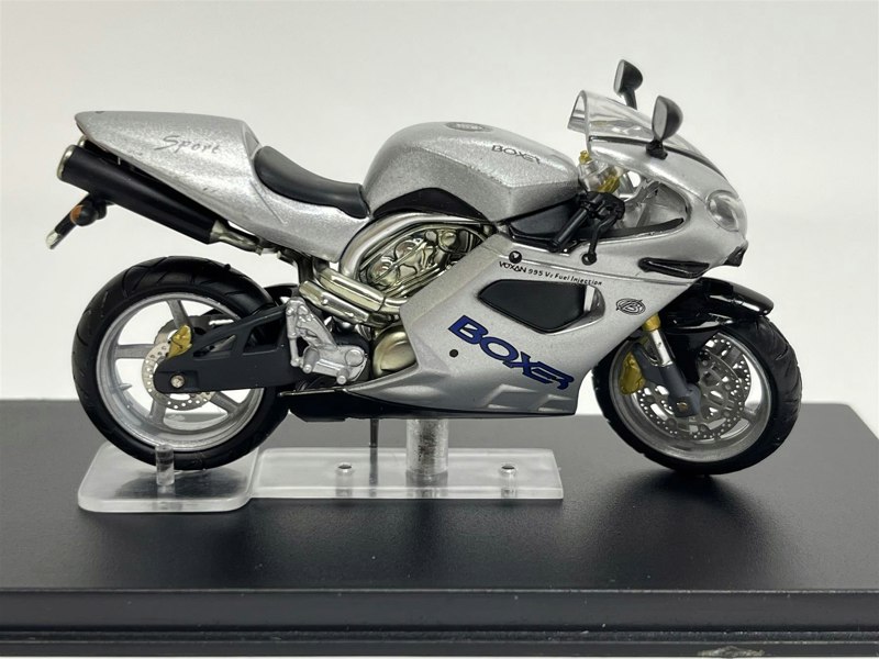 a silver motorcycle on a stand