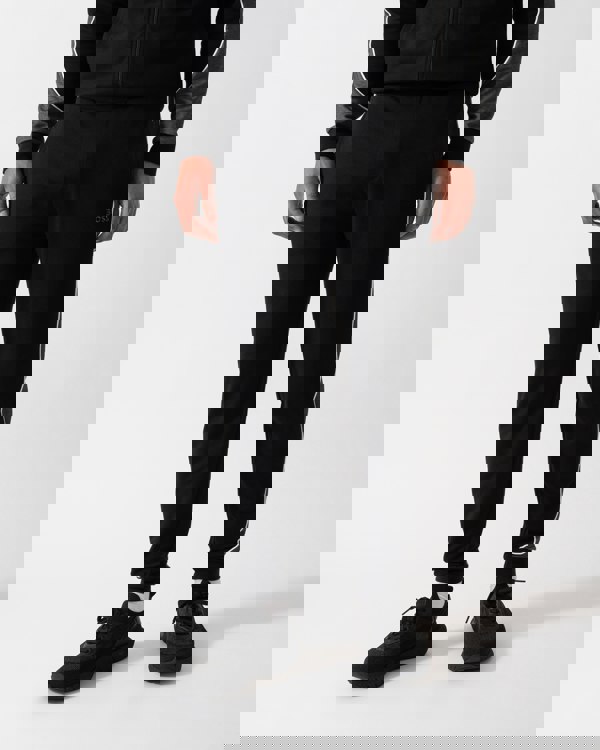 Close up shot of a Model wearing a BOSS Orange Mens Loungewear Tracksuit Pants in Black