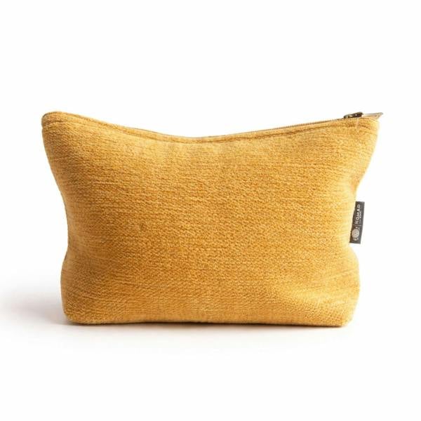Mustard yellow jacquard toiletry bag with top zipper and textured woven surface