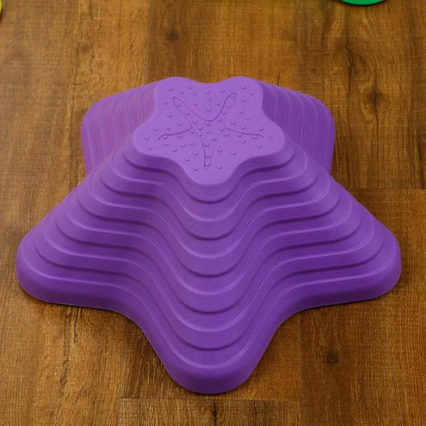 Purple starfish-shaped stepping stone with raised texture and ridged base.