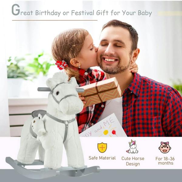 White plush rocking horse with gray saddle, held close as a gift