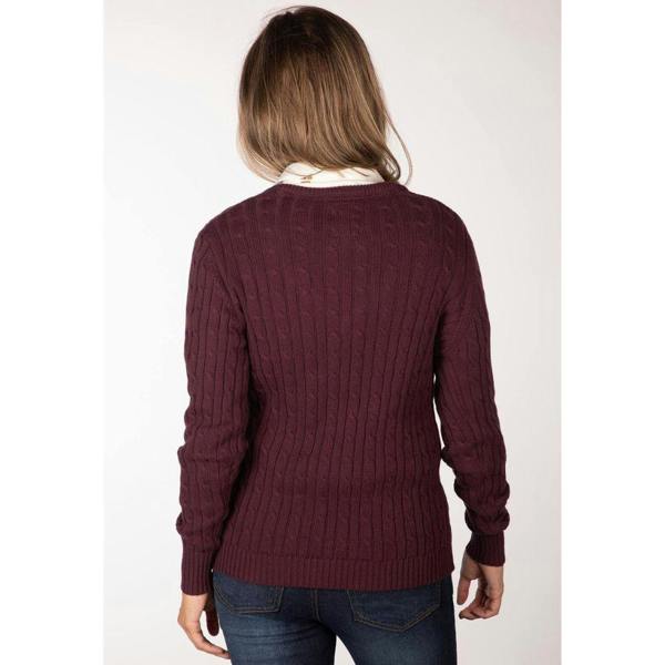 Woman wearing the Rydale Emma V Neck Cable Knit Jumper in burgundy layered over a white country shirt, showing the flattering V neck and cable knit design.