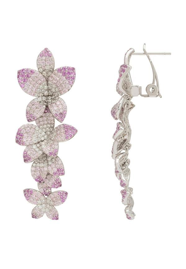 Flower-shaped earrings with purple and clear gemstones on a white background