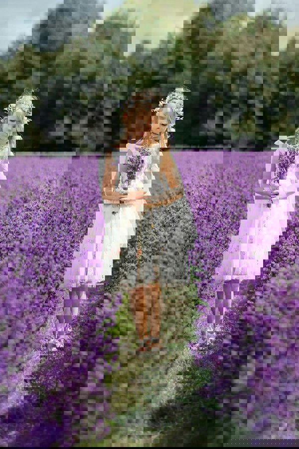 young flower girl holding flowers