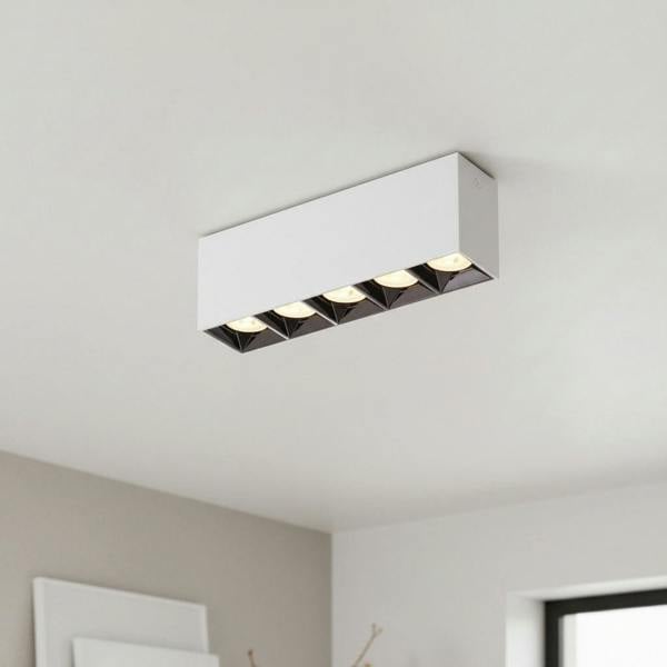 white modern flush ceiling light mounted on the ceiling in a moder kitchen