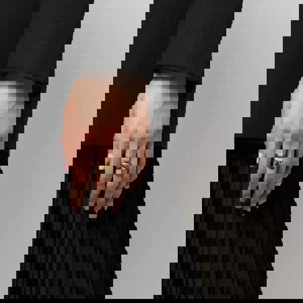 Alexander McQueen hinged double signet ring in a gold tone finish