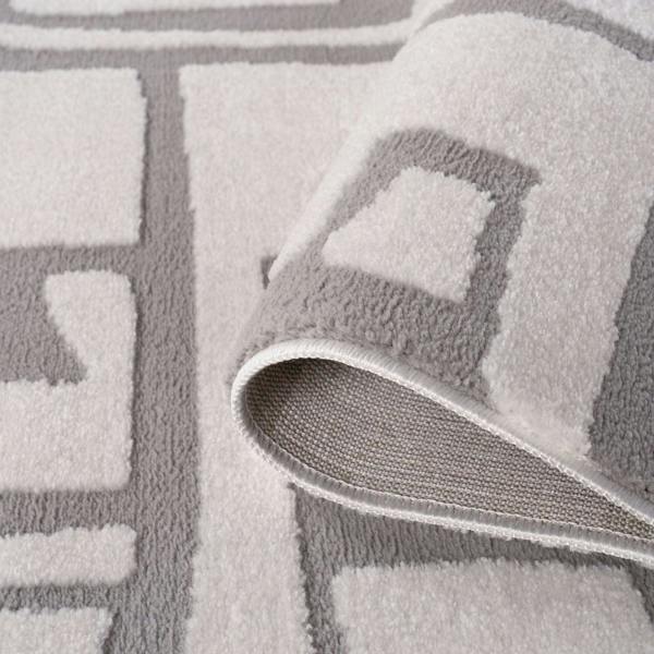 Gray textured rug with geometric pattern