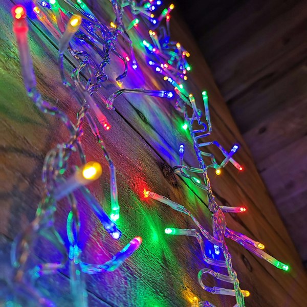 Samuel Alexander 960 LED 12m Premier Cluster Indoor Outdoor Multi Function Mains Operated Christmas Lights with Timer on Clear Cable in Multicoloured